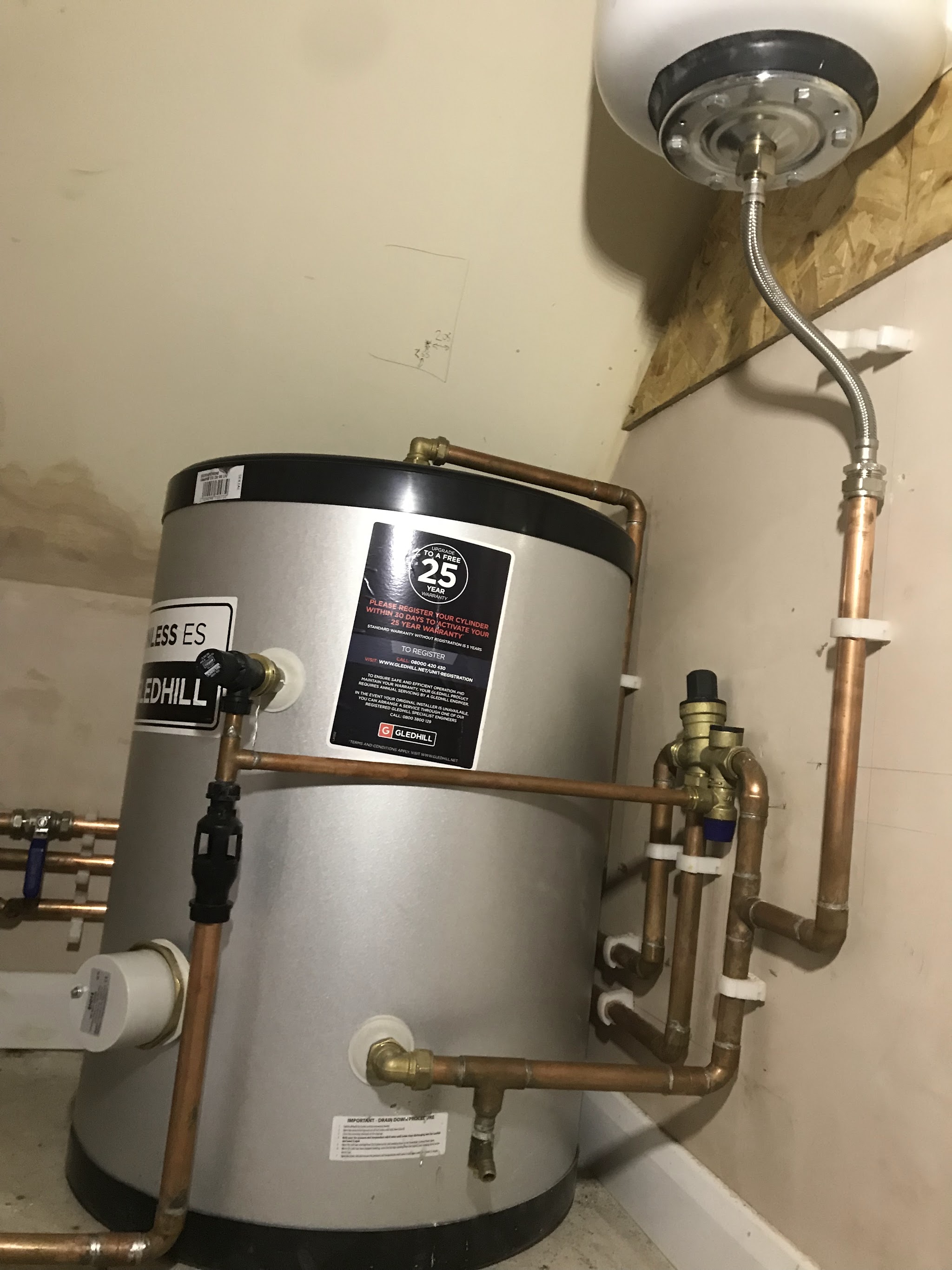 Unvented hot water cylinder with copper pipework and expansion vessel